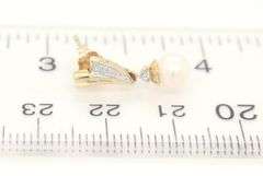 10kt Yellow gold pearl and diamond accent drop earrings
