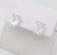 Stunning Certified 7.13CTW Emerald Cut Diamond Studs