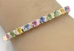 14kt Yellow gold 3.50ctw multi color sapphire and diamond bangle