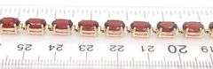 14kt Yellow gold oval garnet tennis bracelet