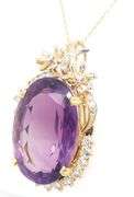 18kt Yellow gold oval Amethyst with diamond around pendant on chain