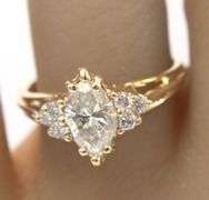 14kt Yellow gold 1ct marquise in 0.12ctw diamond setting