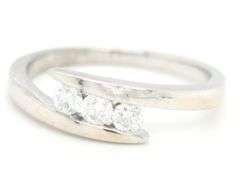 14kt White gold 0.35ctw 3 stone diamond bypass band