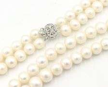 Set of white freshwater pearl double strand necklace and matching bracelet