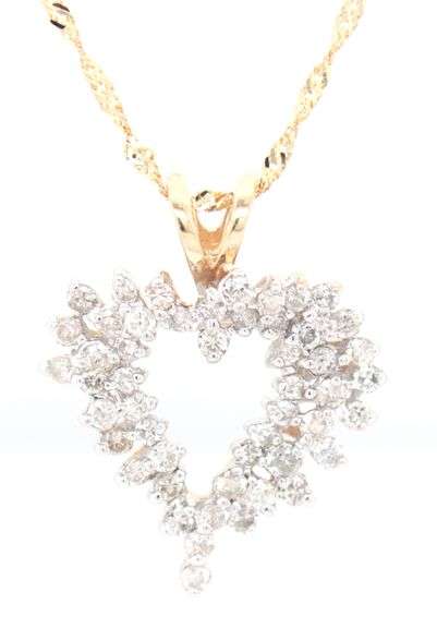 14kt Yellow gold diamond heart shaped pendant on chain