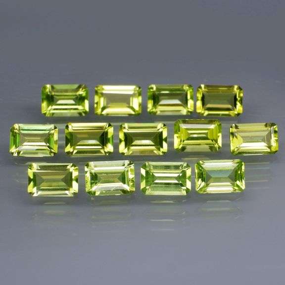Brilliant 7.84ct 13pc set of matched baguette cut Peridot