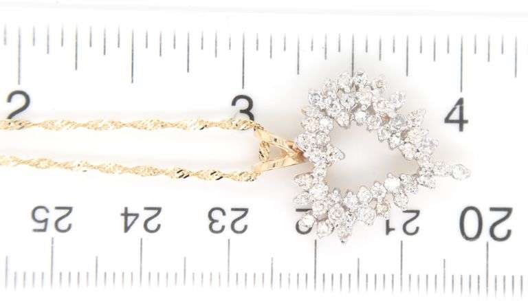 14kt Yellow gold diamond heart shaped pendant on chain