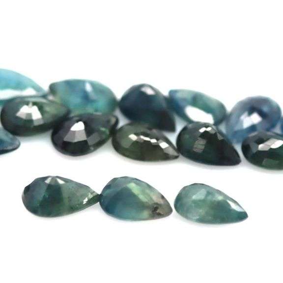 Heated only! 8.65ct greenish blue sapphire set