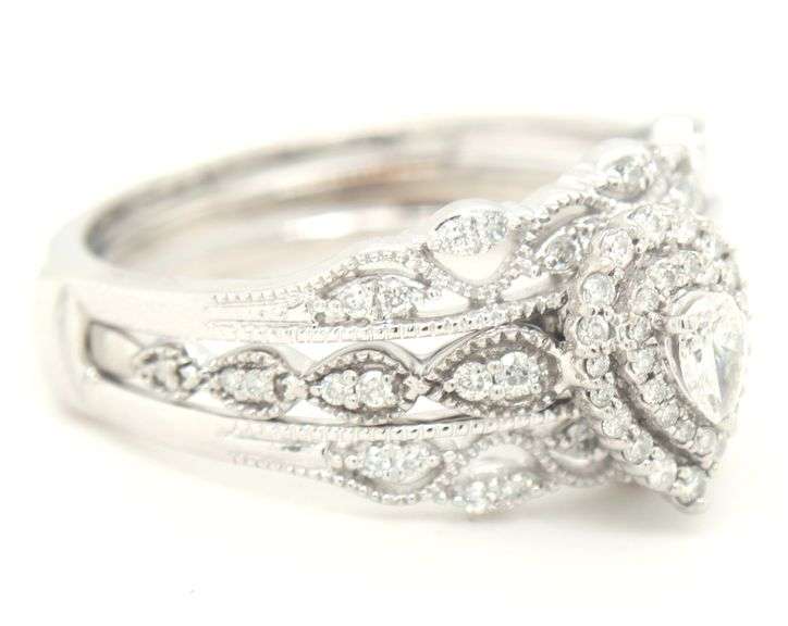 14kt White gold 0.65ctw pear shaped and RBC double halo Milgrain engagement ring