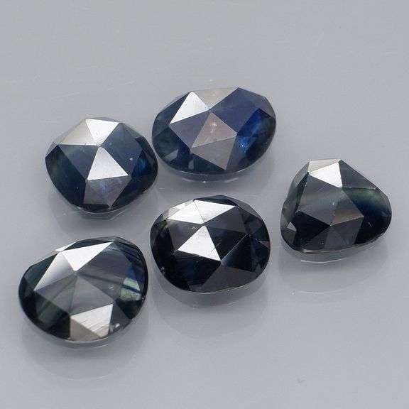 Heated only! 7.12ct blue green Sapphire set
