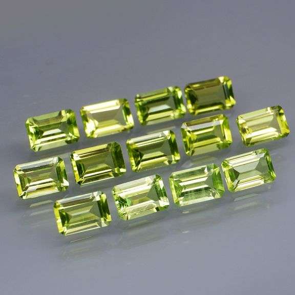 Brilliant 7.84ct 13pc set of matched baguette cut Peridot