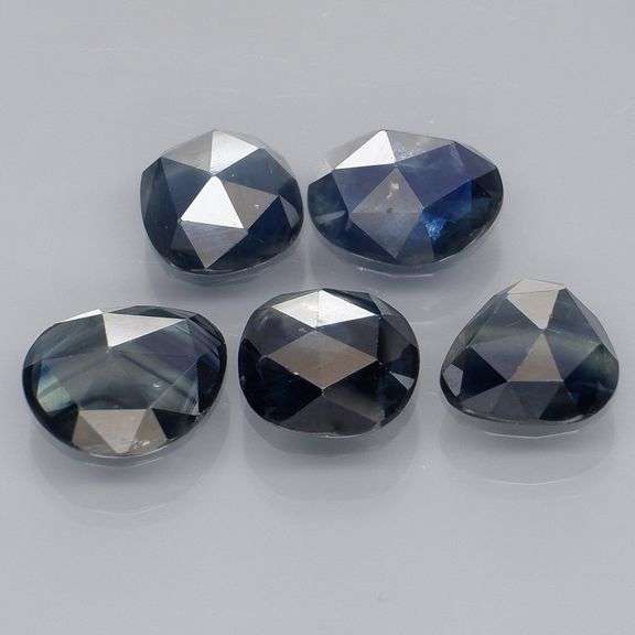 Heated only! 7.12ct blue green Sapphire set