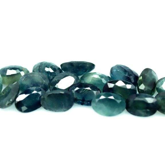 Heated only! 10.52ct blue green Sapphire set