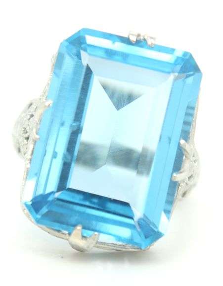 18kt White gold 13.50ct blue Topaz in punch work setting