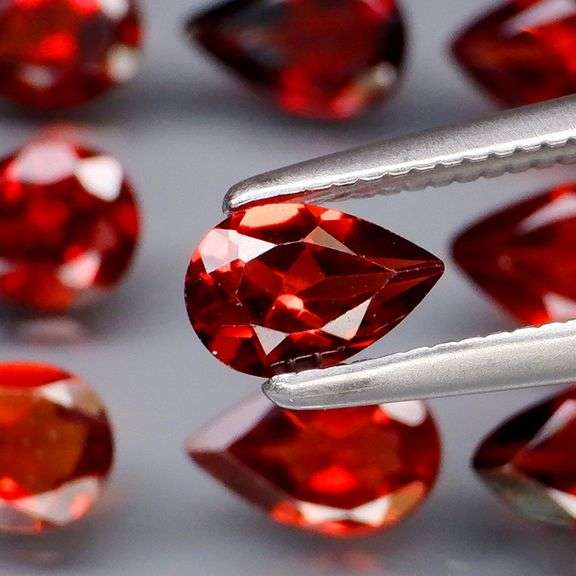 Premium 7.62ct pear cut cherry red Garnet set