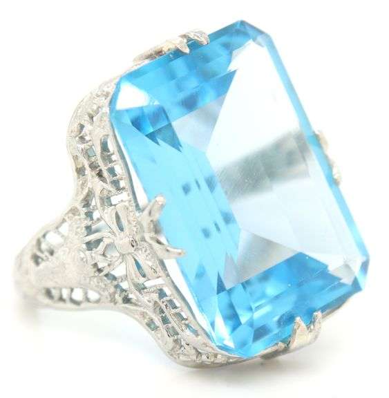 18kt White gold 13.50ct blue Topaz in punch work setting