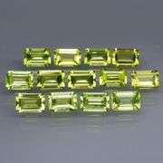 Brilliant 7.84ct 13pc set of matched baguette cut Peridot