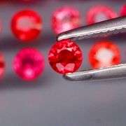 Uniquely colored 3.28ct imperial red Sapphire set