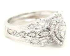 14kt White gold 0.65ctw pear shaped and RBC double halo Milgrain engagement ring