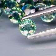 Stunning blue green 3.76ct round cut Sapphire set