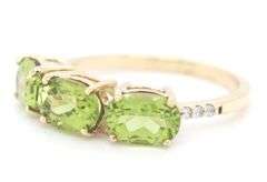 9kt Yellow gold oval Peridot and diamond accent ring