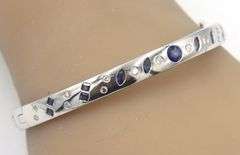 14kt White gold sapphire and diamond burnished set bangle bracelet
