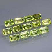 Brilliant 7.84ct 13pc set of matched baguette cut Peridot