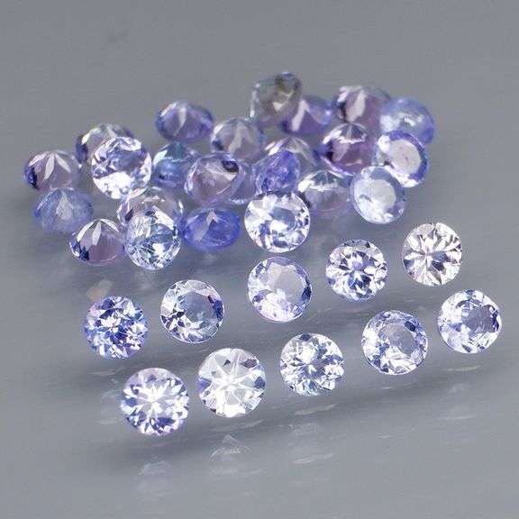 Heavy flashing 4.02ct diamond cut Tanzanite set