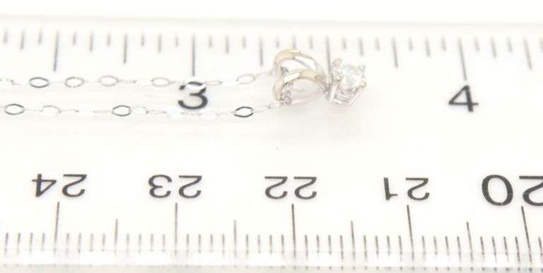 14kt White gold round brilliant cut diamond solitaire pendant on chain