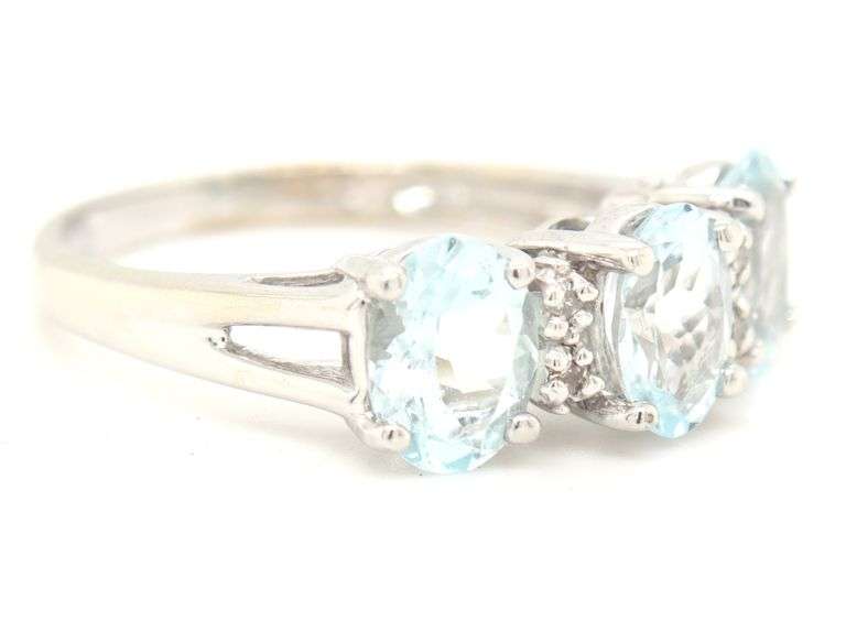 14kt White gold oval Aquamarine and diamond accent 3 stone ring