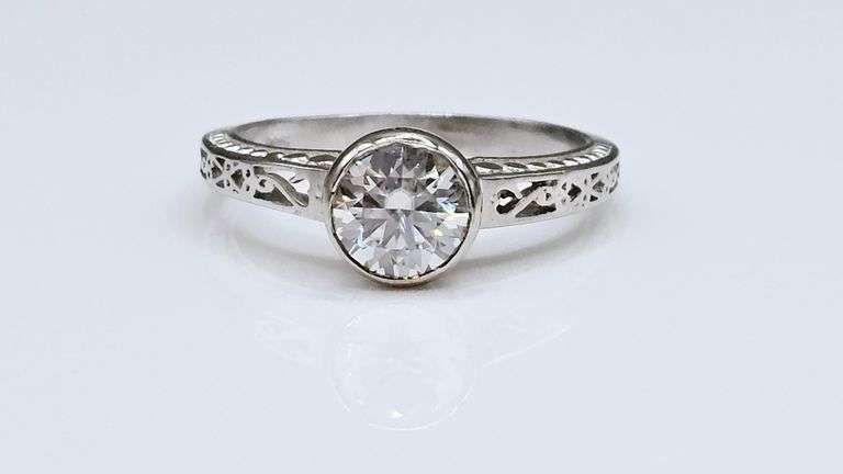 Sparkling 14 Kt White Gold Plated 1.5 Ct Lab Simulated Diamond Ring.