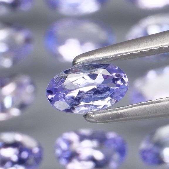 Heavy flashing 3.62ct oval cut Tanzanite set