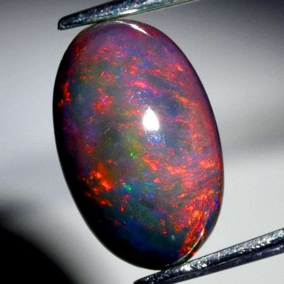 Smoldering flashing 2.34ct Welo Black Opal