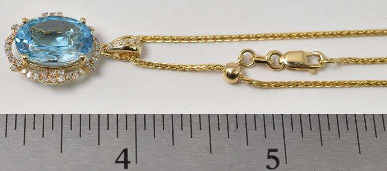 Brilliant Blue Topaz and Diamond Pendant in 14K Yellow Gold