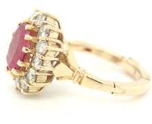 14kt Yellow gold oval ruby and diamond halo ring