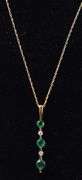 Ravishing Emerald and Diamond Pendant Necklace in 14K Yellow Gold