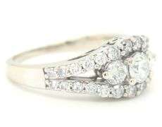 14kt White gold 1.50ctw 3 stone diamond split shank engagement ring