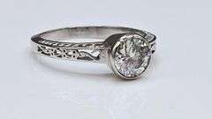 Sparkling 14 Kt White Gold Plated 1.5 Ct Lab Simulated Diamond Ring.