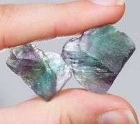 Glowing 80ct rough bi-color Fluorite pair