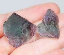 Glowing 80ct rough bi-color Fluorite pair