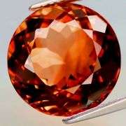 Impressive 12.74ct full fire VS Imperial Topaz solitaire