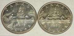 Both Varieties 1957 BU Canada Silver Dollars