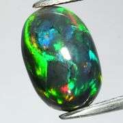 Magnificent 2.63ct full body flashing Black Opal
