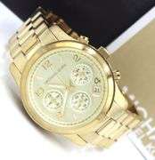 Micheal Kors mid size Chronograph gold tone watch