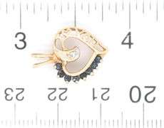 10kt Yellow gold heart shaped blue sapphire pendant