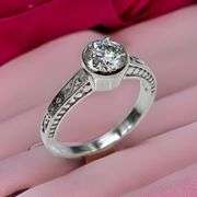 Sparkling 14 Kt White Gold Plated 1.5 Ct Lab Simulated Diamond Ring.
