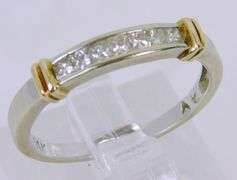 14K Ring with 7 Princess Cut Diamonds, Size 6.5
