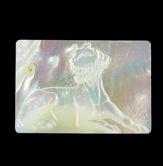 Shimmering 30ct dog carving in Mother of Pearl