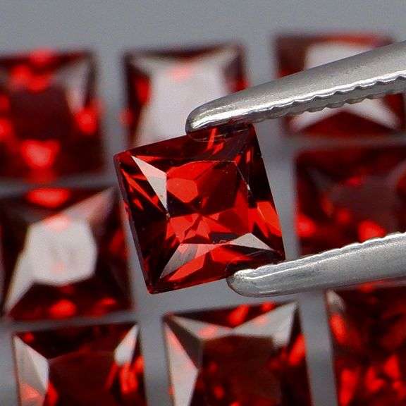 Tremendous 6.79ct princess cut cherry red Garnet set