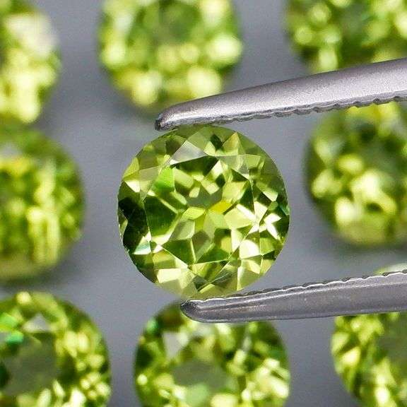 Dazzling 4.90ct untreated apple green Peridot set